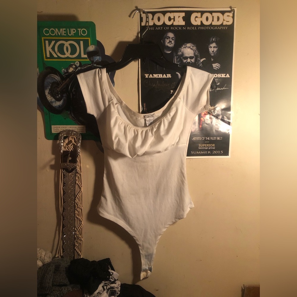 Rue 21 Size XS color white and it’s a bodysuit
